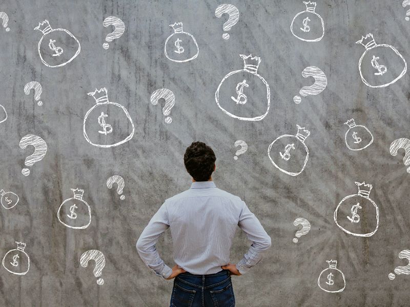 man trying to decide about money